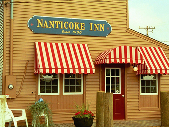 naticoke inn red and white awnings over red door